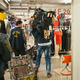 A trader carries a shipment of jeans through a mall in Guangzhou. Many traders stay in Guangzhou after their visas expire, hoping to remain undetected until they make enough money to go home. Some are caught in regular police stings, and others give up, relying on the charity of African-community organizations for airfare home.